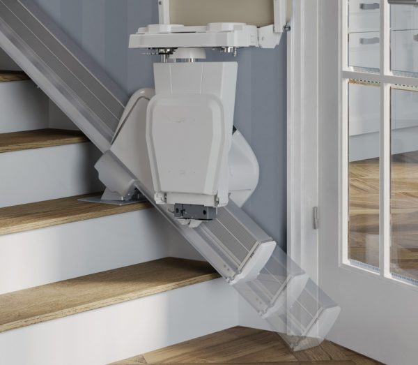Handicare 1100 Stairlift folded at the bottom of the stairs