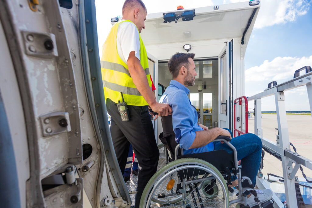 Wheelchair user getting off a plane