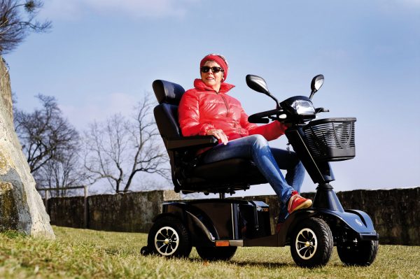 Sunrise Medical S700 Mobility Scooter with a person riding it